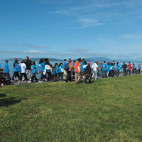 Participants at Northern California Hemophilia Walk standing on grass