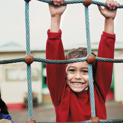Boy with hemophilia on playground