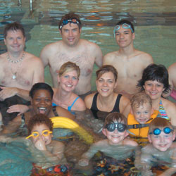 Adults and children in the pool