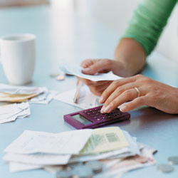 Using a calculator to add up medical expenses