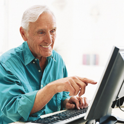 Man with hemophilia on computer