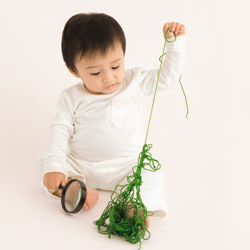 Child with factor VII deficiency plays with yarn