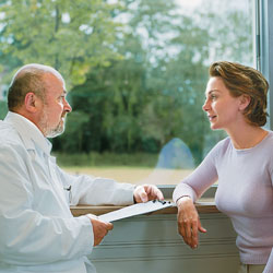 Doctor and woman with bleeding disorder