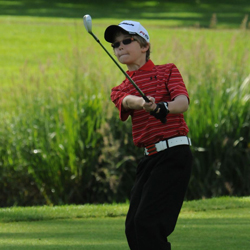 Ben Gruher chips in during Oregon Junior Golf tournament.