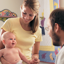 A baby with hemophilia visiting the doctor with his mom