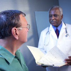 Doctor talking to male patient