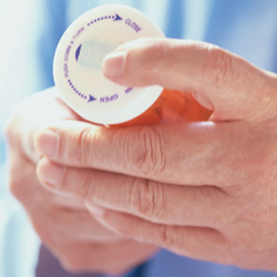 Man holding prescription bottle