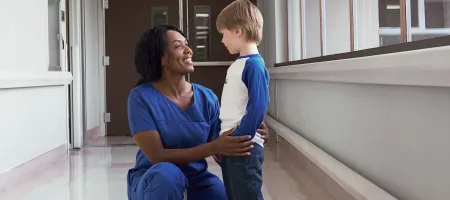 HTC nurse comforts young boy